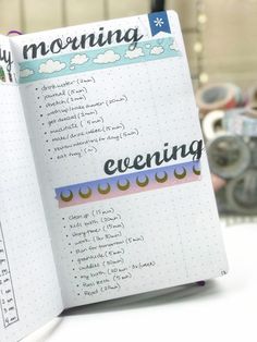 an open planner book sitting on top of a table