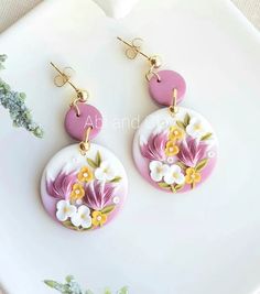 pink and white flower earrings with gold accents