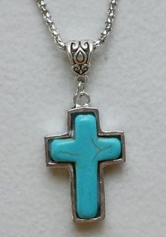 "CROSS: Zinc alloy / turquoise blue stone 1-1/4\" x 7/8\" CHAIN: Zinc alloy 18\" with lobster clasp. Come Visit Us at Our New Store! Please feel free to email me with questions about this item. Also please check my other listings. I am always available to answer your questions promptly. Buy from us with confidence." Adjustable Turquoise Cross Jewelry, Silver Turquoise Cross Necklace For Gift, Adjustable Blue Cross Necklace, Blue Adjustable Cross Necklace, Blue Turquoise Necklace With Adjustable Chain For Gift, Adjustable Turquoise Necklace As A Gift, Adjustable Turquoise Necklace For Gift, Adjustable Light Blue Turquoise Necklace Gift, Blue Spiritual Metal Jewelry