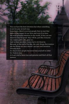 a bench sitting in the rain with a poem written on it's back side