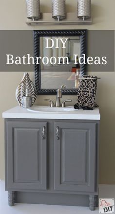 a bathroom sink sitting under a mirror next to a wall mounted faucet with candles on it