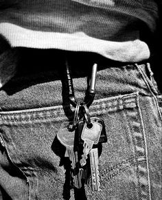 there is a bunch of keys in the pocket of someone's jeans