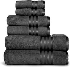 a stack of black towels sitting on top of each other