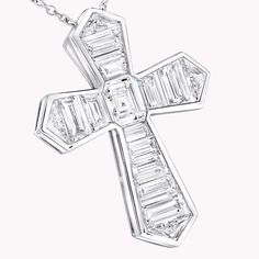 A contemporary interpretation of a classic motif, this Cross pendant in 18 carat white gold is beautifully crafted to showcase the sleek beauty of baguette cut diamonds. Custom cut to fit the design, the diamonds are individually handset by our master artisans to taper in size as they radiate outwards. An elegant Classic Graff cross motif baguette cut diamond pendant with a total weight of approximately 3.06 carats. Luxury White Gold Diamond Necklace With Baguette Diamonds, Diamond White Platinum Necklace With Baguette Diamonds, Platinum Diamond Necklace With Baguette Diamonds, White Diamond Baguette Cut Necklace, Platinum Diamond White Necklace With Baguette Diamonds, White Gold Diamond Necklace With Baguette Diamonds In Platinum, Luxury Diamond White Necklace With Baguette Diamonds, Silver Diamond Necklace With Baguette Diamonds, Silver Baguette Cut Diamond Necklace