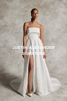 a woman in a white dress with the words, justin anexlander signature