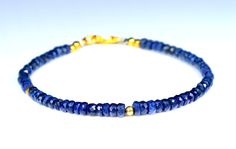 This is a beautiful blue Sapphire gemstone bracelet The sparkling gemstones are a sky blue with facets that catch the light beautifully. The precious stones are a very good quality Blue gemstone, bracelet made from natural faceted blue sapphire beads , elegant and precious The Sapphire rondelles are strung on the highest quality metal strand beading wire,which is extremely strong and flexible. The natural blue Sapphire measure 3 OT 4 mm approximately You'll receive this exact item as shown in the photos above. Elegant Sapphire Bracelets With Faceted Beads, Elegant Sapphire Bracelet With Faceted Beads, Blue Gemstone Beads Bangle Bracelet, Blue Bangle Bracelets With Gemstone Beads, Blue Faceted Rondelle Bracelets, Blue Gemstone Bead Bangle, Blue Gemstone Beads Bangle, Blue Gemstone Beads Bangle Jewelry, Blue Rondelle Beaded Bracelets With Polished Beads