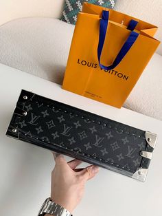 Elevate your watch collection with this Louis Vuitton-inspired Coffret 8 Montres Bag in the iconic Monogram Eclipse canvas. This luxurious case offers a sophisticated and secure storage solution for up to eight watches, ensuring their safety and protection during travel. The sleek black design with ruthenium metallic hardware adds a touch of understated elegance, while the removable tray and S-lock closure provide convenience and peace of mind. 34*18*11 CM Disclaimer: This product is inspired by Luxury Black Rectangular Case, Luxury Rectangular Cases, Black Designer Rectangular Cases, Designer Black Travel Cases, Luxury Rectangular Case For Gifts, Luxury Rectangular Cases For Gifts, Luxury Gift Cases, Luxury Rectangular Gift Cases, Luxury Black Round Case