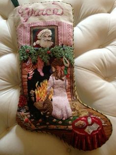 a christmas stocking with an image of santa claus hanging from it's side