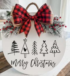 a merry christmas sign with red and black bows