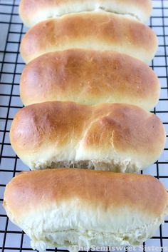 four hot dogs on a cooling rack ready to be baked into buns or sandwiches