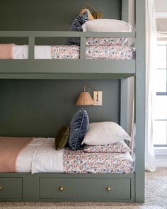 bunk beds with pillows on them in a bedroom