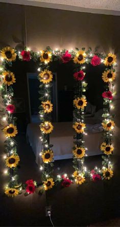 a sunflower decorated with lights in the shape of a frame