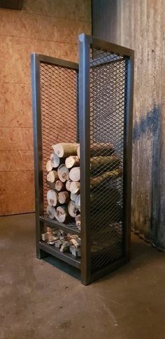 a stack of logs sitting inside of a metal container