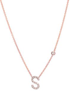 Beautifully handcrafted 14k gold pave diamond initial and a small bezel diamond on a dainty cable link chain necklace. Available in yellow, white, and rose gold. This stunning piece will be you new favorite necklace! Wear it with your initial, or your loved one's Made in L.A. Size of initial: Approx. 8mm(H) by 6mm(W) Bezel diamond: 0.03 (ct.), clarity VS Diamond initial: 0.11(ct.) Ships in 4-9 business days All personalized items are Final Sale Comes gift ready in a custom Zoe Lev jewelry box. Diamond Initial Necklace, Evil Eye Necklace Gold, Bezel Necklace, Vs Diamond, Link Chain Necklace, Evil Eye Necklace, Gold Price, Bezel Diamond, Eye Necklace