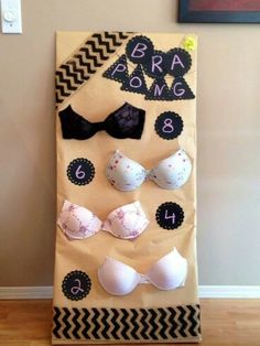 a bulletin board with bras on it in front of a wall and a door