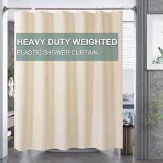 a shower curtain with the words heavy duty weighted plastic shower curtain in front of it