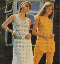 two women in crocheted dresses standing next to each other