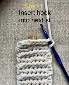 the crochet hook is being used to make a knitted pouch for knitting