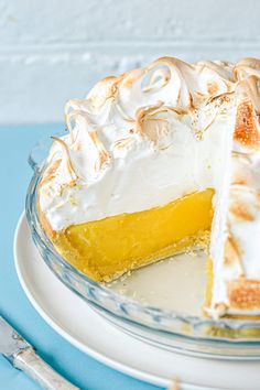 a lemon meringue pie on a white plate