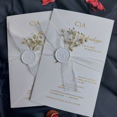 two wedding cards with flowers on them