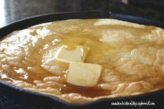 a skillet filled with food sitting on top of a stove