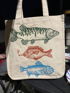 a tote bag with two fish on it