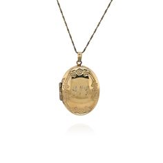 "Measurements: Chain is 19 and 1/2 inches in length. Pendant is 1 and 7/16 inches long from top of bail, 7/8 inch wide, 1/4 inch thick Weight: 8.9g Hallmark: Chain: \"925 DANECRAFT\" Pendant: \"EL STERLING\" Metal: Sterling Silver, Gold Overlay **Engraved with initials \"GNC\" All items are in good, pre-loved condition. If you have any questions or would like to see more photos, send me a message. Your happiness, satisfaction, and confidence in the products are always important to me." Classic Oval Engraved Necklaces, Oval Formal Jewelry With Hallmarks, Classic Oval Engraved Necklace, Engraved Oval Link Wedding Jewelry, Heirloom Oval Engraved Necklaces, Heirloom Oval Engraved Necklace, Heirloom Oval Etched Necklace, Traditional Etched Oval Jewelry, Classic Oval Etched Jewelry