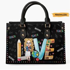 a black handbag with an image of a woman holding a pencil and book on it