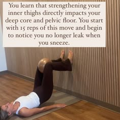 a woman laying on the floor with her legs up and arms behind her back as if she is doing yoga