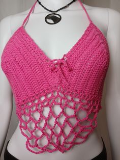 Hot Pink Rave & Festival Crochet Crop Halter with center lacing, adjustable neck ties and belly dancer style chain edging on bottom. The extra long bottom ties may be wrapped entirely around the rib cage & tied in front or left long and back tied.Made from 100% reclaimed cotton yarn1 of 1 Pink Stretch Halter Top For Festival, Stretch Pink Halter Top For Festivals, Adjustable Crochet Top For Festival, Bohemian Stretch Crochet Top For Party, Handmade Fitted Crochet Top For Festival, Festival Pink Halter Neck Crochet Top, Pink Crochet Crop Top For Festival, Handmade Fitted Halter Top For Festivals, Stretch Crochet Halter Neck Top For Festival