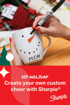 a woman holding a coffee mug with a snowman drawn on it and the words, diy holiday create your own custom cheer