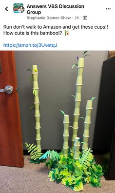 a bunch of fake bamboo sticks sitting on top of a floor next to a door