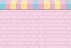 a pink brick wall with a striped awning over it's top and bottom