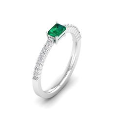 This exquisite emerald diamond ring in a stunning piece of jewelry that exudes elegance and sophistication. The vibrant emerald gemstone is beautifully complemented by the sparkling diamonds set in a lustrous white gold band, creating a timeless and luxurious look that is perfect for any special occasion. Metal: 14K Gold Setting Type: Prong Rhodium Finish: Yes, on White Gold Gemstone Details: Gemstone: Emerald Shape: Emerald Cut Average Dimensions: 5.00 x 3.00 MM Quantity: 01 Average Cut: Very G White Emerald Ring With Prong Setting, Emerald And Diamond Band, Dance Jewelry, Emerald Diamond Ring, Birthstone Gifts, Ring Pendant Necklace, White Gold Band, Emerald Gemstone, Diamond Band