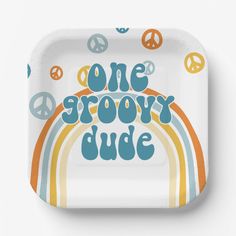 a paper plate with the words one grooy dude in rainbows and peace signs