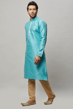 Brocade self embossed kurta with minimal gold embroidery on the placket and contrasting churidar Crafted with a collar neckline, full sleeves, and front hook closure. Occasion: Can be worn to lighter events like Mehendi, Puja, or a small party WASH CARE INSTRUCTIONS - Please Dry clean only when it is applicable. Slight color variation is possible due to digital photography. Semi-formal Straight Kurta With Resham Embroidery, Semi-formal Long Sleeve Kurta For Diwali, Semi-formal Long Sleeve Embroidered Kurta, Semi-formal Long Sleeve Kurta With Chikankari Embroidery, Semi-formal Resham Embroidery Kurta For Diwali, Diwali Semi-formal Kurta With Resham Embroidery, Festive Kurta With Dabka And Stand Collar, Semi-formal Kurta With Pallu For Diwali, Semi-formal Long Sleeve Kurta With Zari Work