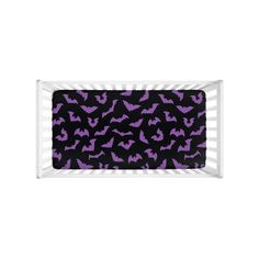 a rectangular tray with purple bats on it