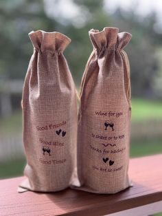 two burlock bags sitting on top of a wooden table