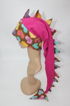 the head of a mannequin wearing a colorful hat