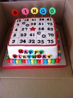 a birthday cake in the shape of a sudato board with numbers and letters on it