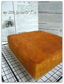 a cake sitting on top of a cooling rack next to a piece of paper that says, my little favorite day