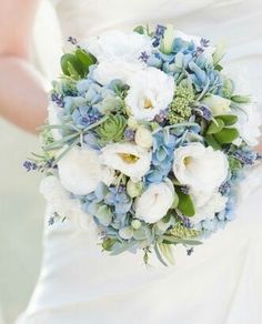 a bridal bouquet with white and blue flowers