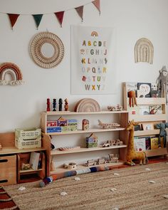 a child's room with toys and bookshelves