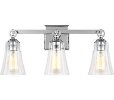 three light bathroom fixture with clear glass shades and chrome finish, on an isolated wall