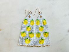 When life gives you lemons...you wear them! These earrings are absolutely gorgeous and will keep you 'cool' this summer! These earrings are made with delicate Miyuki Delica beads and each bead is hand woven. These are super light.  The ear wire is base metal and is nickel and lead free. Please let me know if I can answer any questions. I can customize any order too! Visit my Etsy shop for more: https://etsy.me/3my7URS Length - 3 inches Drop length - 3.5 inches Width - 1 inch Handmade Beaded Drop Earrings For Summer, Yellow Beaded Drop Earrings For Summer, Summer Yellow Dangling Beads Earrings, Summer Beach Earrings With Tiny Beads, Yellow Summer Earrings With Dangling Beads, Yellow Dangling Beads Earrings For Summer, Summer Yellow Earrings With Dangling Beads, Handmade Summer Dangle Beaded Earrings, Handmade Summer Beaded Dangle Earrings