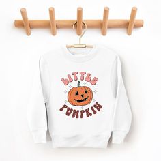 Looking for a cute sweatshirt for your kids? We have the perfect Little Pumpkin Retro graphic sweatshirt addition to their closet! Also available in toddler sweatshirts. Cute Sweatshirts, Top Graphic Tees, Halloween Town, Kids Outfits Girls, Tee Shop, Pullover Sweatshirt, Sleeve Styles, Short Sleeve Tee, Graphic Sweatshirt