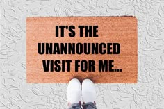 someone is standing in front of a door mat that says it's the unannounced visit for me