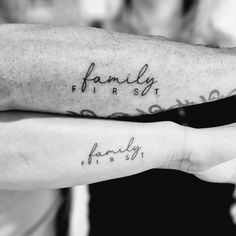 two people with tattoos on their arms that say family first and family second, one is holding the other's hand