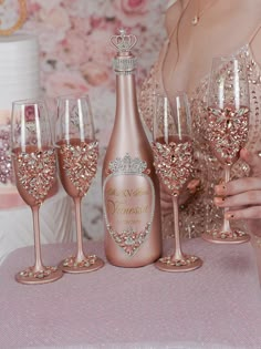 a woman sitting at a table with wine glasses