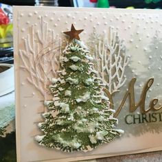 a card with a christmas tree on it